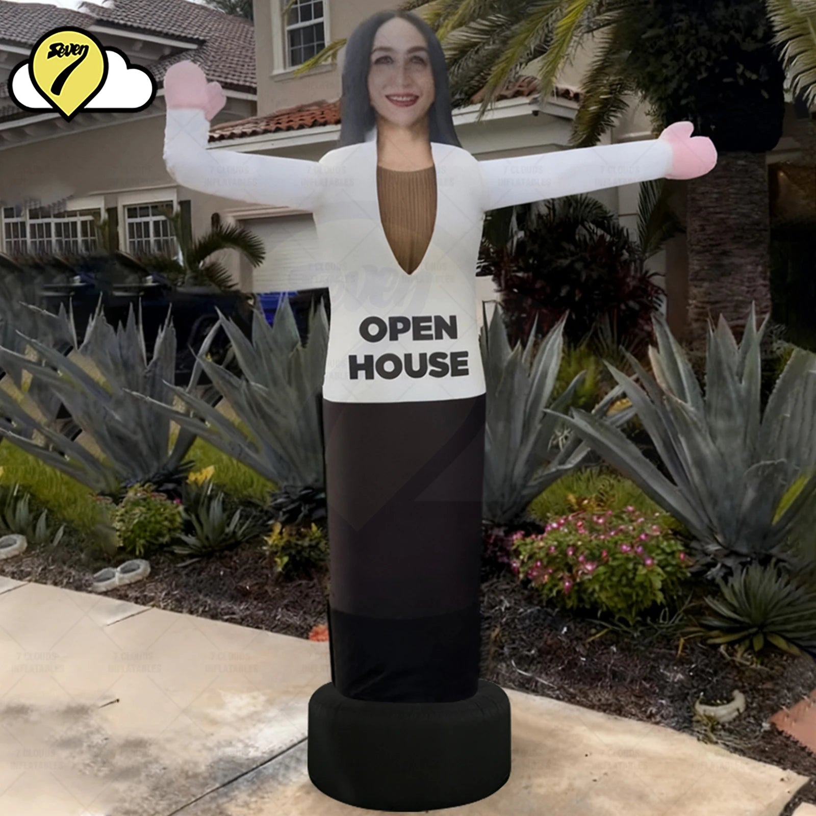 Tubeman gonflable installé devant une maison à vendre
