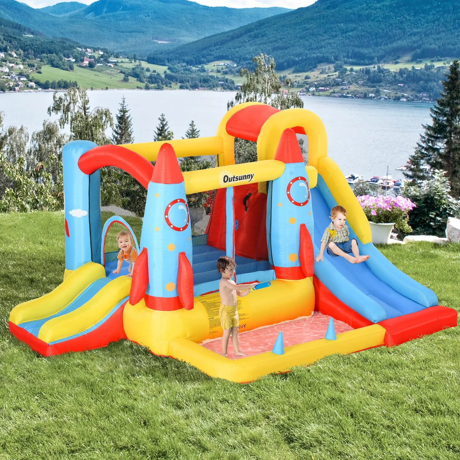 Château gonflable thème spatial vue d'ensemble avec toboggans et piscine