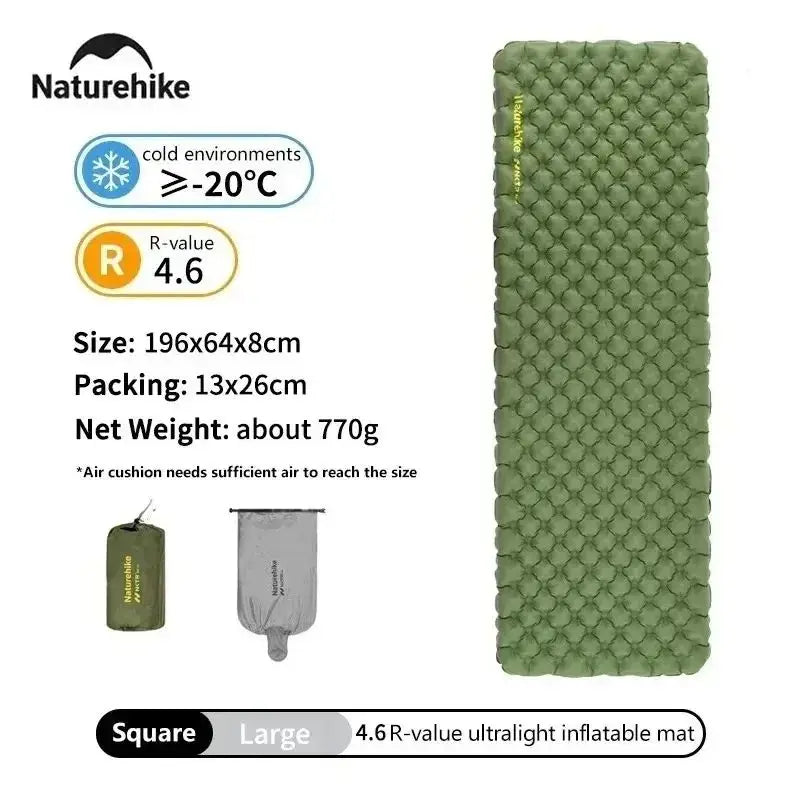 Matelas gonflable posé sur sol rocailleux en montagne