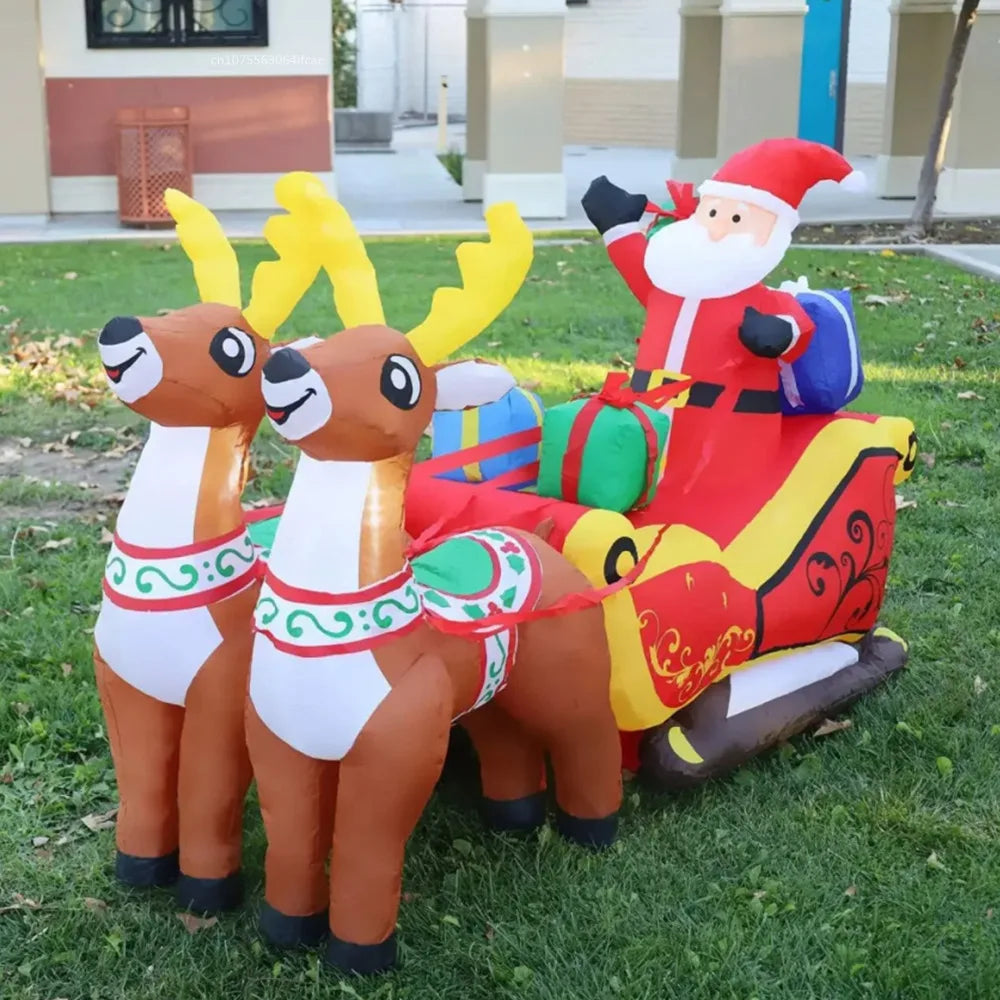 Renne et traîneau gonflables de Noël installés dans un jardin