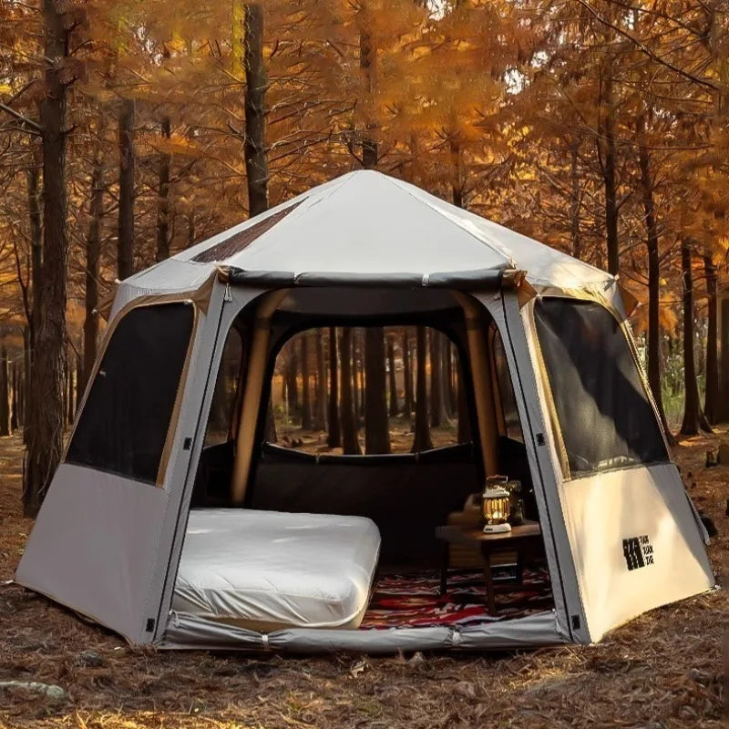 Tente gonflable hexagonale grande famille installée en camping
